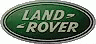 the land rover sign is green and white with a red arrow