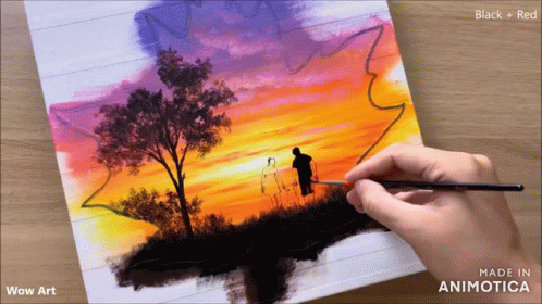 a person is painting with a knife on the table