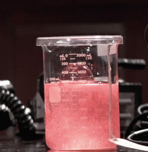 a test tube filled with liquid sitting on a table