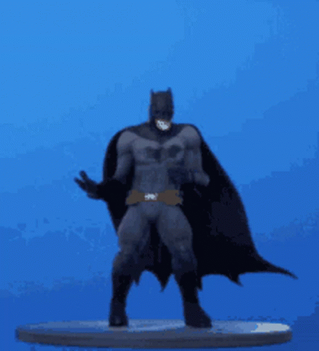 a man with a batman mask standing on top of a surfboard