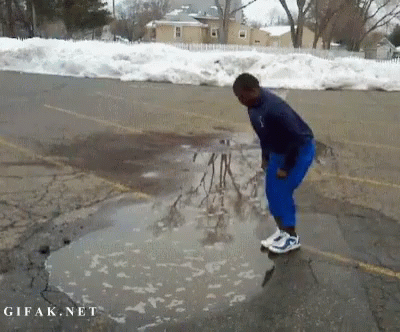 a person skate boarding down the side of a road
