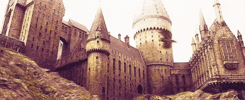 a castle with many towers and towers in the background