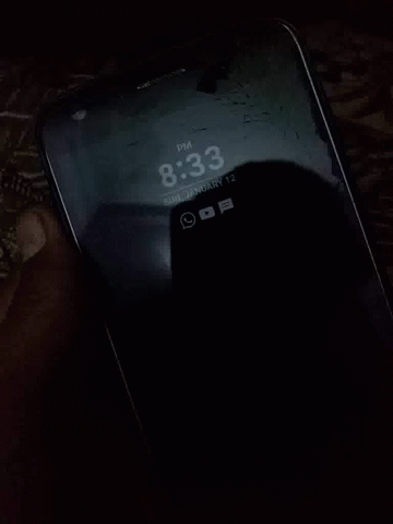 a cellphone lit up in the dark