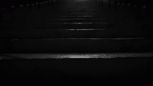 black and white pograph of a stairway at night