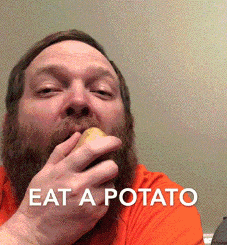 a man is eating a potato and text says eat a potato