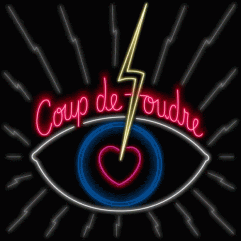 the word'coup de tours'is displayed in front of a neon sign