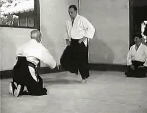 the men are practicing karate in the old time