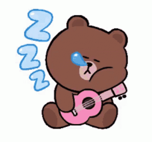 a teddy bear sitting down playing the guitar