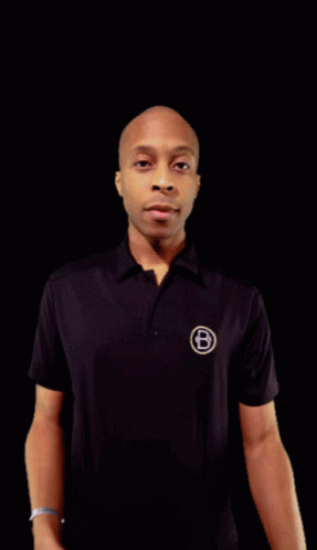 a man in a polo shirt standing