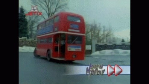 this is a blue double decker bus driving down a street
