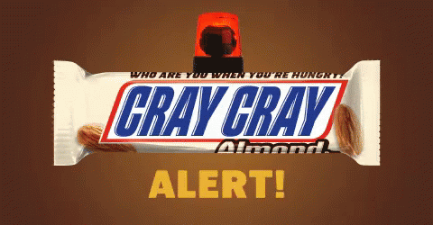 a bar of gray grey almond on top of blue background