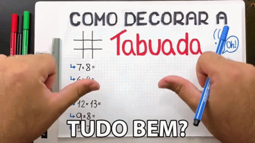 the words tudo bem and comodecoracar written on a whiteboard in a room with colored pencils