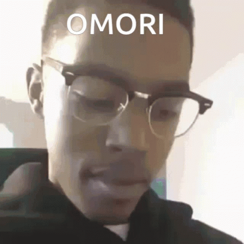 a man in glasses and the word omori above his eye