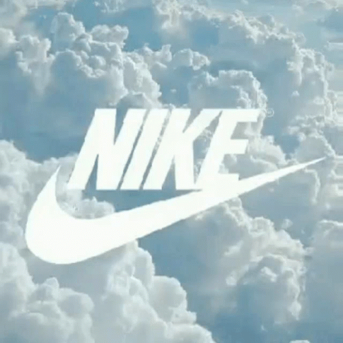 a white nike logo is above some clouds