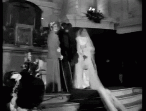 black and white po of bride and groom on stage