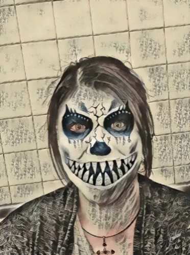 a drawing of a woman with halloween makeup on her face