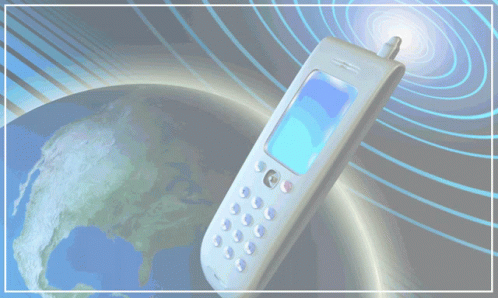 an old cellphone floating over a globe