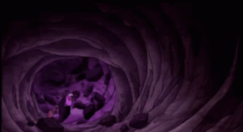 the person in the black jacket is inside of a purple tunnel