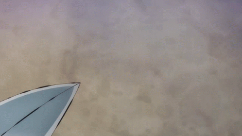 a white kite against a blue sky on a hazy day