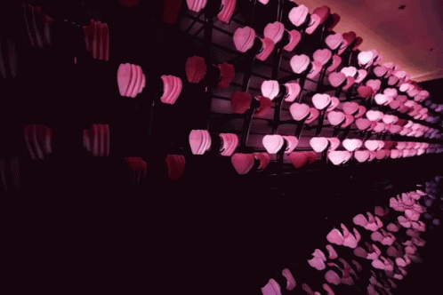 the wall of plastic cups is purple and white