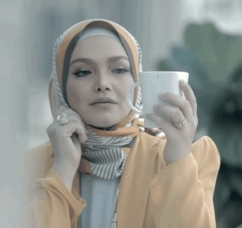 a woman with white skin holding up a cell phone