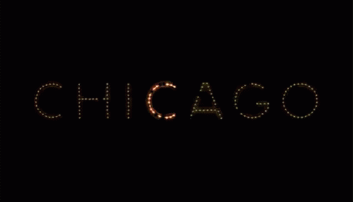 chicago word is lit up against a black background