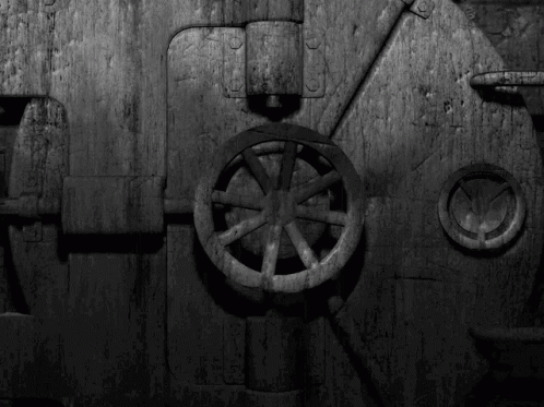 a door with wheels in a dark room