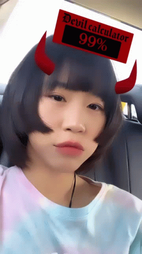 a girl in the back seat with horns sticking out of her head