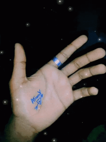 a person showing the palm symbol on their hand