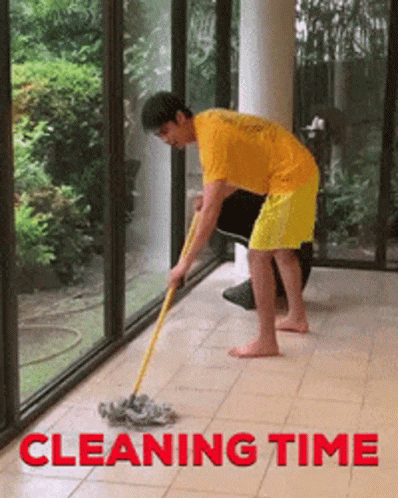 a woman cleaning a floor with a scrubber