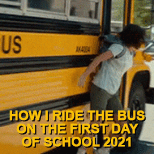 a person is leaning against a school bus