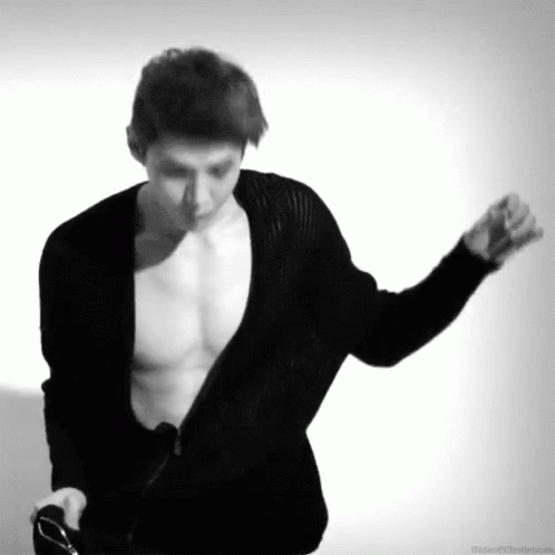 a male dancer with  and his hands out