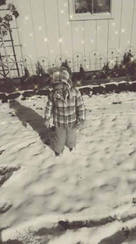 black and white po of a child in the snow