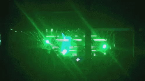 green light is seen in the front of a stage