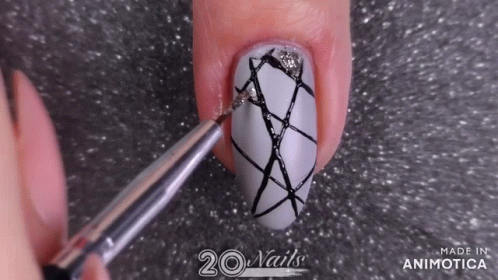 the nails are being decorated with scissors for repair