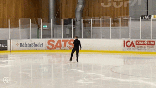 an ice hockey player is standing on the ice