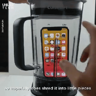 an image of someone using a blender that is full of phone devices