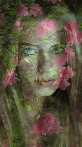 a woman is surrounded by flowers on the face