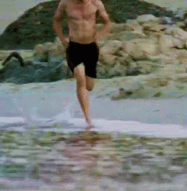 a man that is in the water with a surfboard