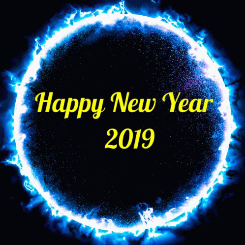 the words happy new year are written in a circle of fire