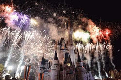 fireworks are shooting in front of a castle