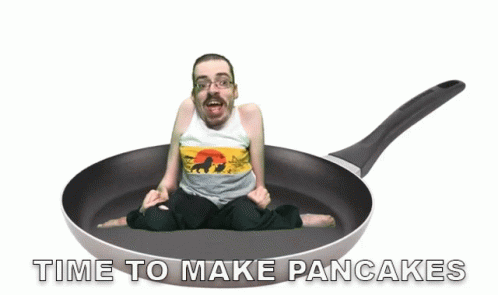 an animated woman in a pan with the words time to make pancakes