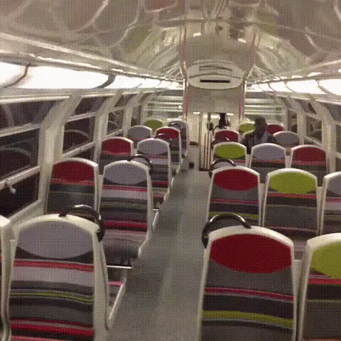 the inside of an airplane, with empty seats and no people