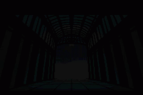 an open long hallway with only lights on