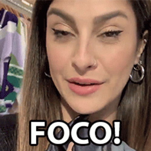 a woman with earrings and makeup with the word foco