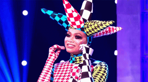 a person wearing checkered clothing and a costume with a face