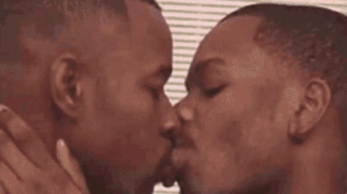 two people kissing each other on the forehead