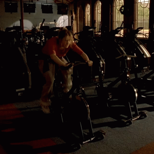 man working out in a gym with some equipment