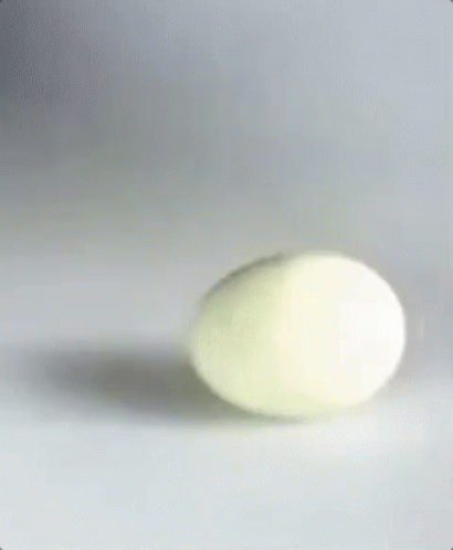 a blurry picture of a blue egg