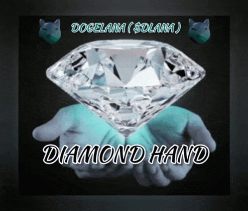 a man's hand holding a large diamond in front of it